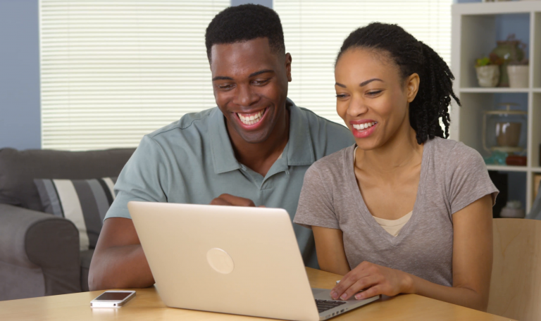 STARS happy-young-black-couple-laughing-and-using-laptop-together_vybjudgzl__F0000